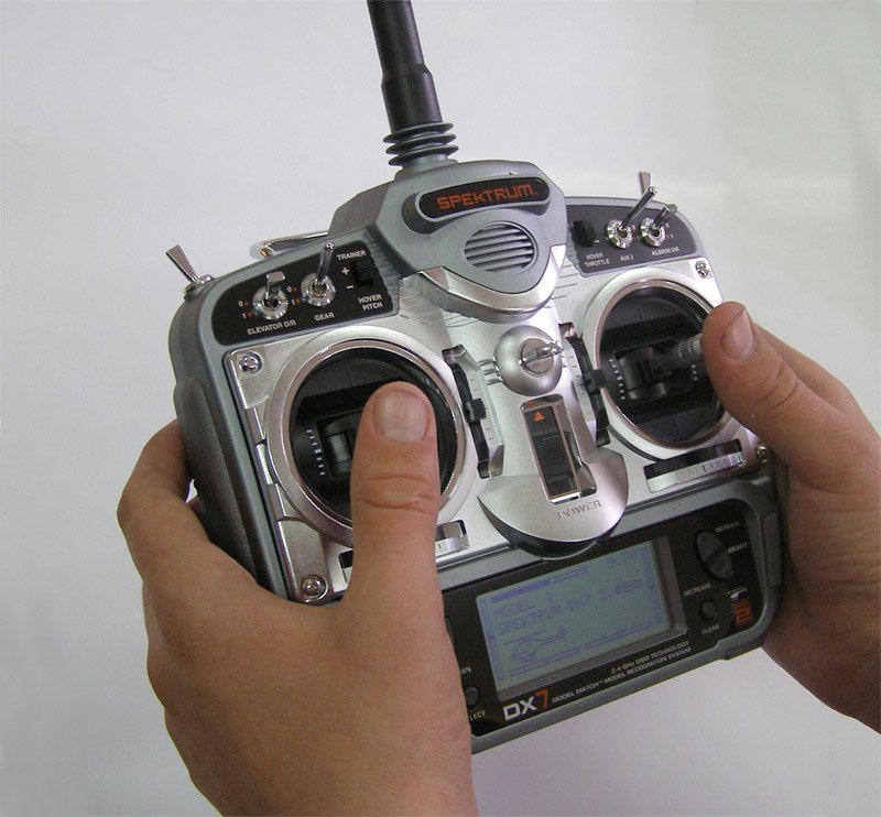 Two hands on the sticks of a hobby RC transmitter
