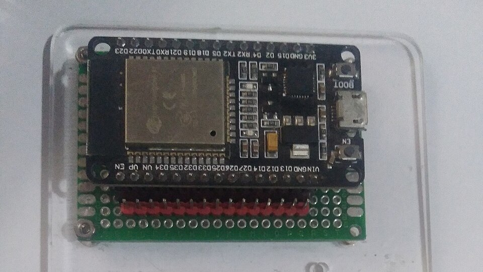 A bare ESP32 dev board soldered onto a green perfboard
